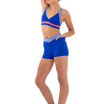 Every Turn Volley Short in Cobalt, side view showing high-waist short with periwinkle V-shaped scontrast waistband