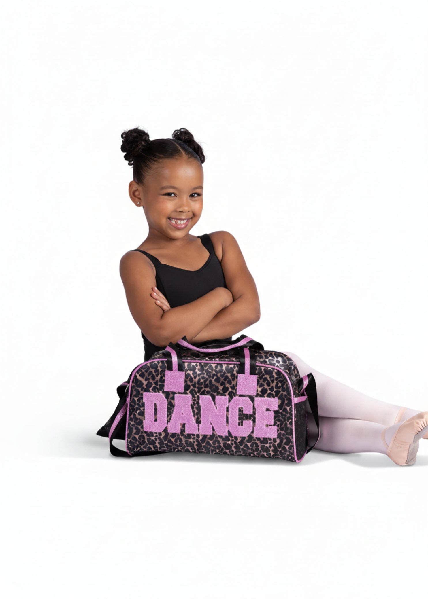 Danznmotion Wild About Dance Duffel in Pink, lifestyle view showing leopard print duffel with pink trim and dual handles
