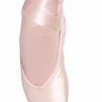 So Danca satin ribbon, lifestyle view showing pink satin ribbon laced and tied around a dancer's foot in a pointe shoe
