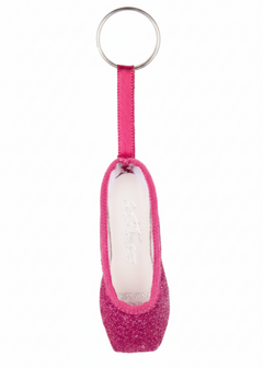 So Danca glitter mini pointe shoe keychain in Hot Pink, side view showing hot pink glitter body, matching fuchsia ribbon strap, white interior lining, and silver split key ring