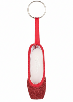 So Danca glitter mini pointe shoe keychain in Red, side view showing red glitter body, matching red ribbon strap, white interior lining, and silver split key ring